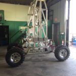 Tall rover with metallic frame and large wheels