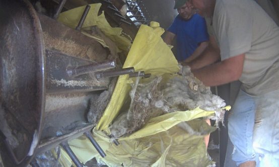 Yellow plastic stuck in cotton module feeder