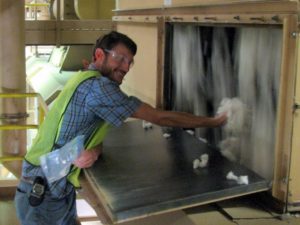 Assistant Professor Robert Hardin collecting cotton from gin